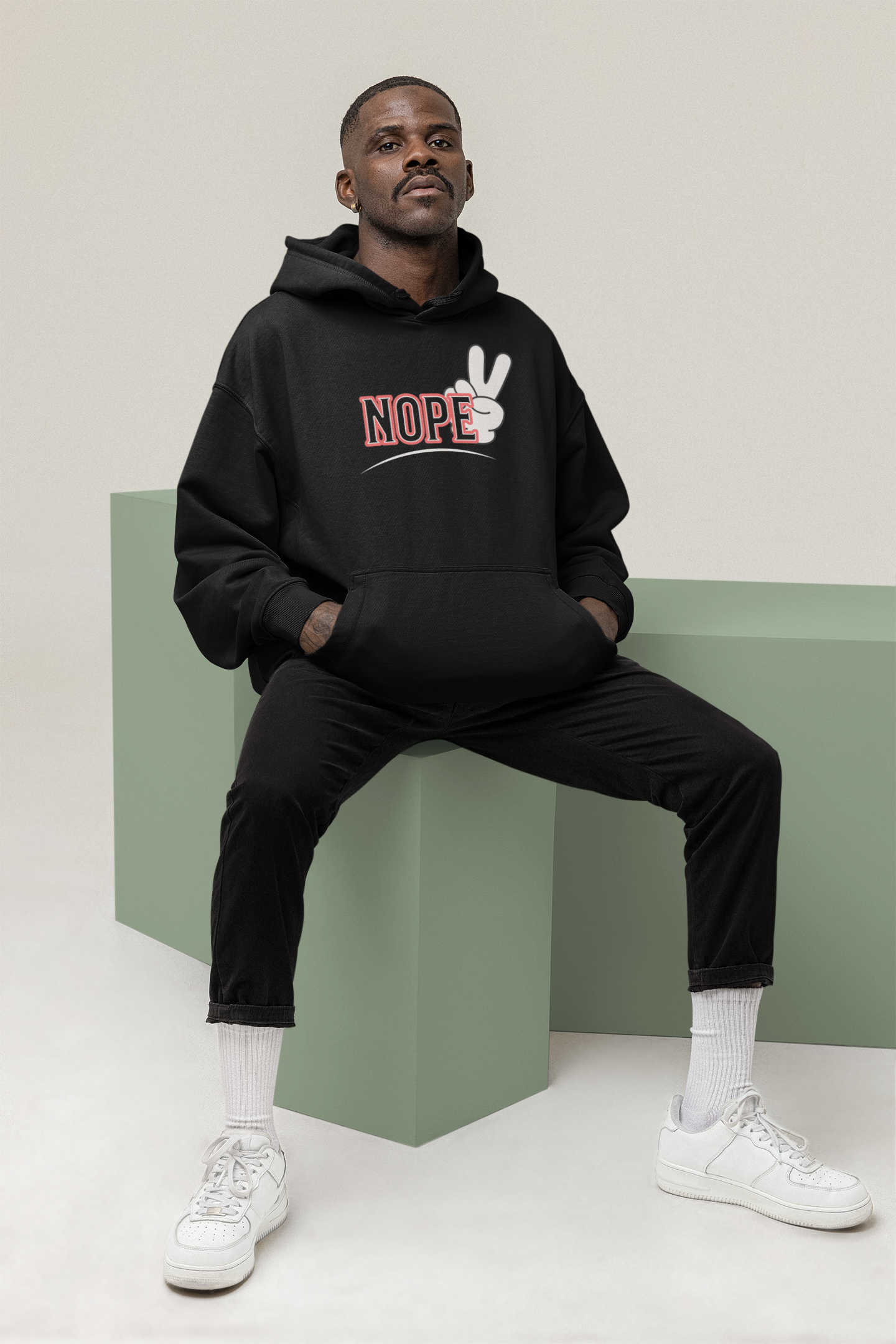 Best hoodies  black & white male sitting down  front posing 