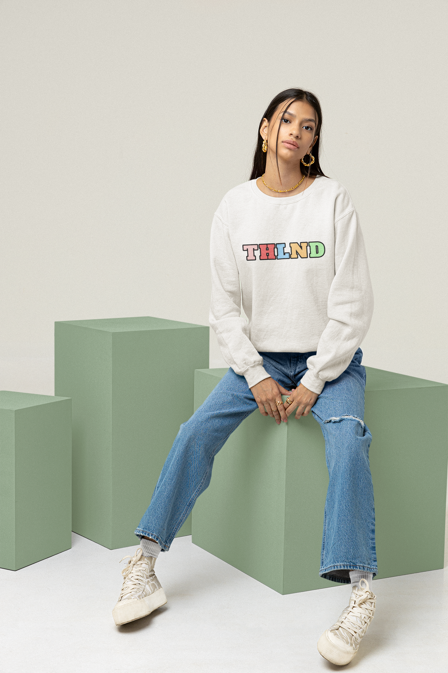 Trendy Sweatshirts Classic white sweatshirt female sitting down front posing